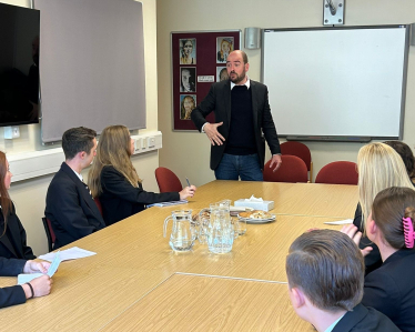 Richard speaking to school pupils